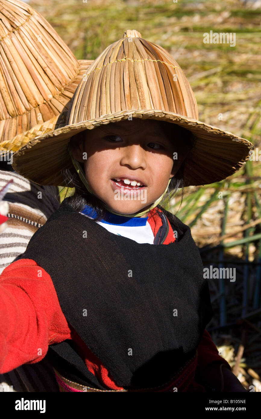 Local boy at a traditional Urus Iruitos floating reed village on the banks of Lake Titicaca in Bolivia Stock Photo