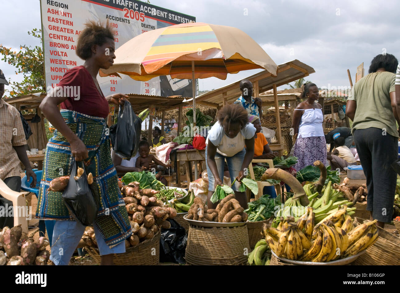 Women selling bananas and cassava, market scene in Naswam, Ghana. Stock Photo
