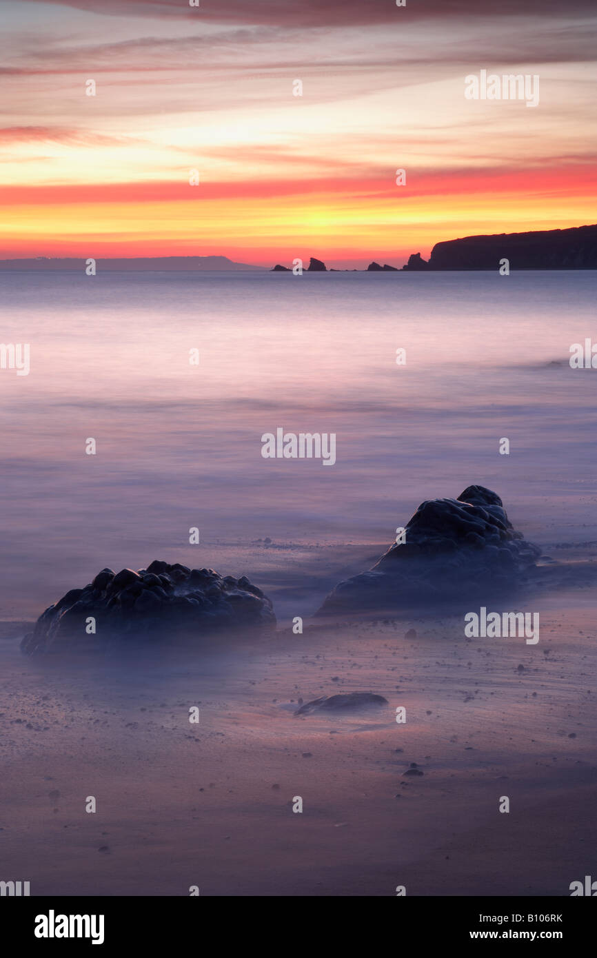 Sunset, Worbarrow Bay, with Mupe Rocks in the background, Dorset, UK Stock Photo
