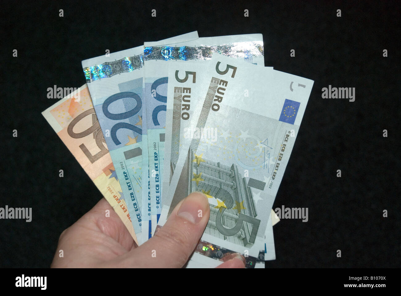 Euro notes held in a hand Stock Photo