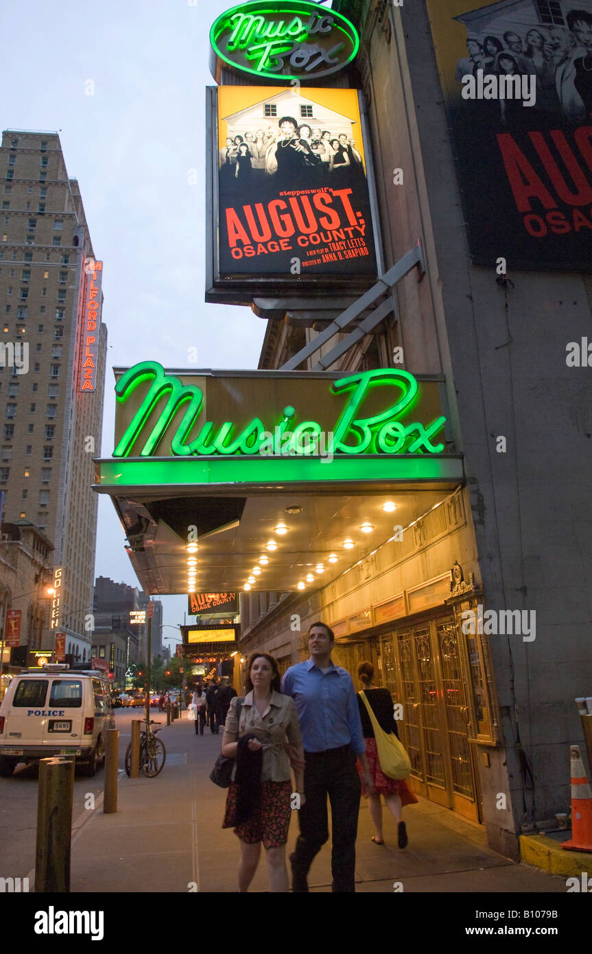 Theater lovers pass the Music Box Theatre showing August Osage County Stock Photo