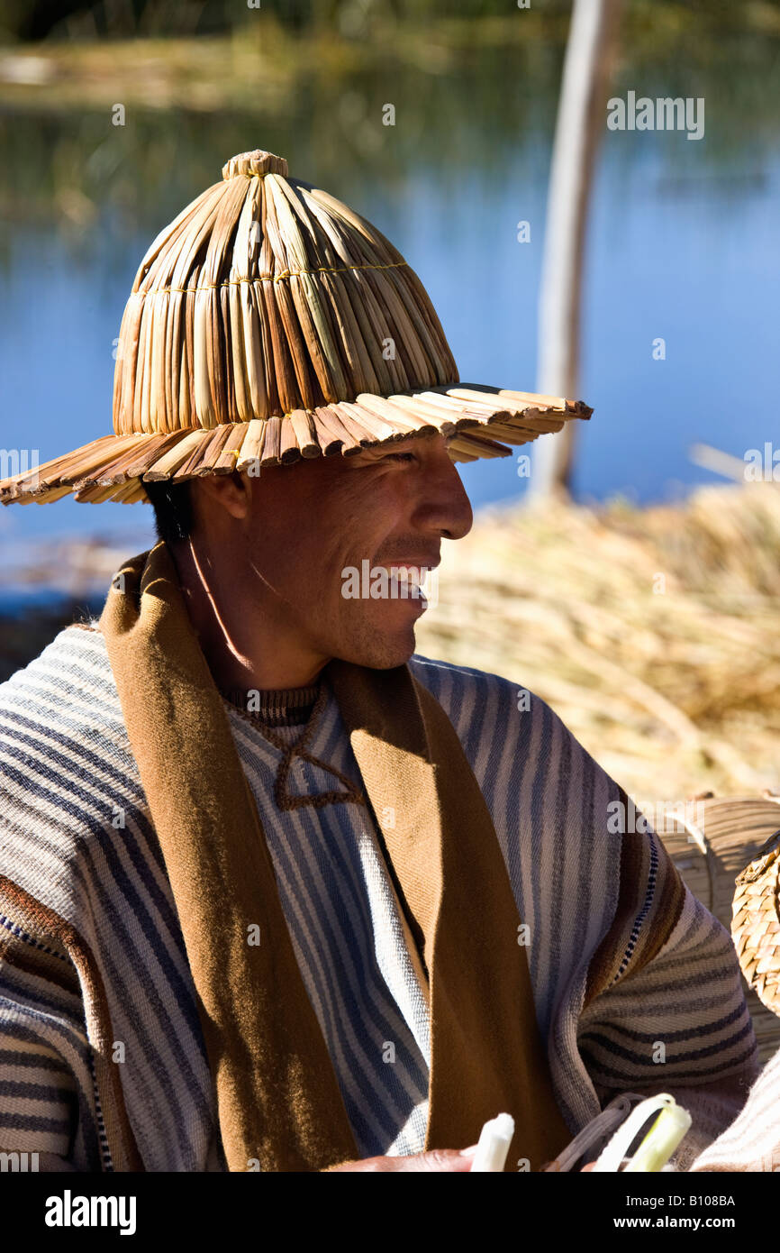 Local man at a traditional Urus Iruitos floating reed village on the ...