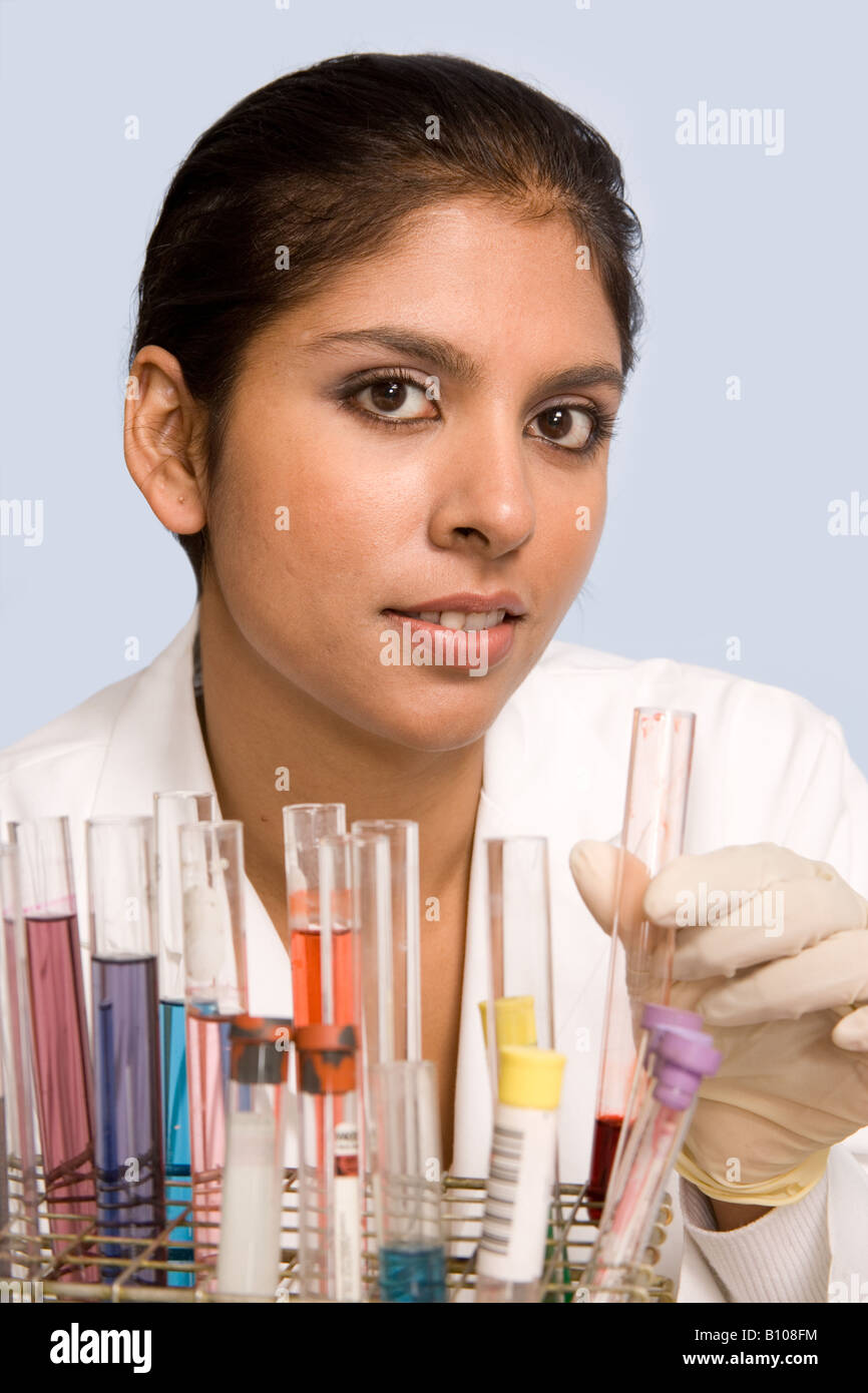 Female research scientist with test tubes in lab. Stock Photo