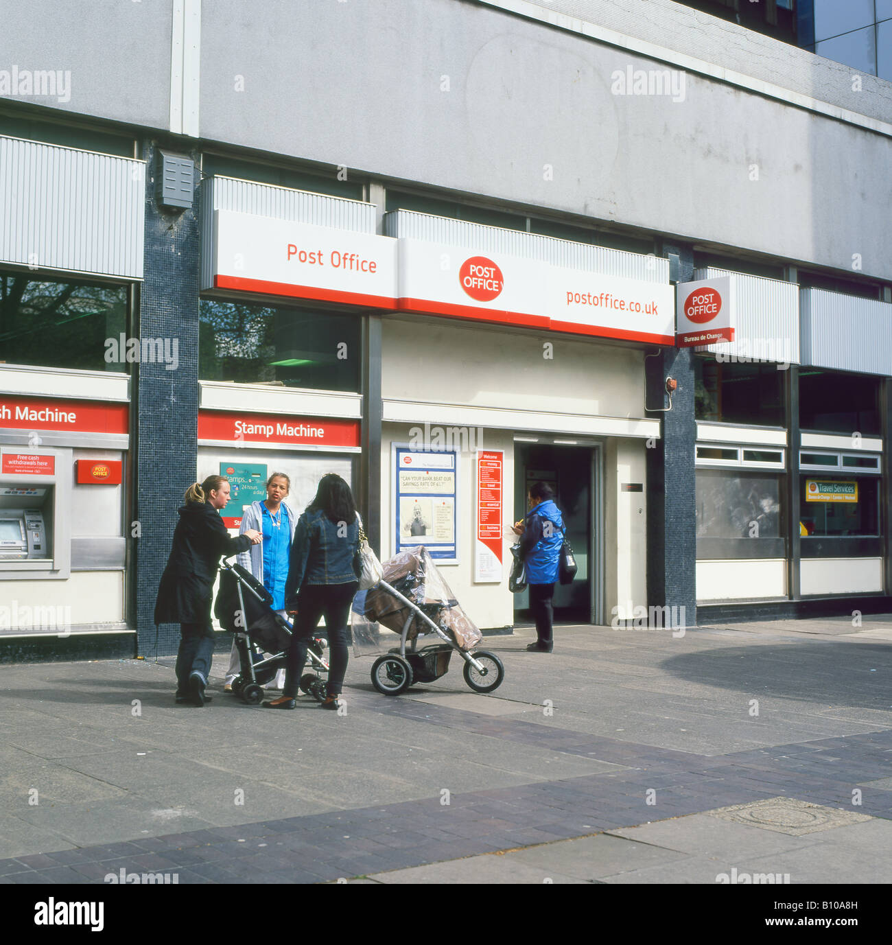 Young mothers with pushchairs outside Old Street Post Office Shoreditch