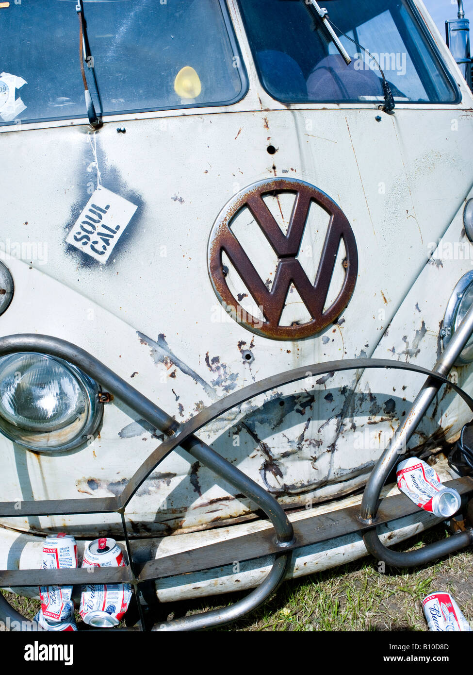 vw volkswagen split screen bus camper van old and worn with lager cans on front bumper Stock Photo
