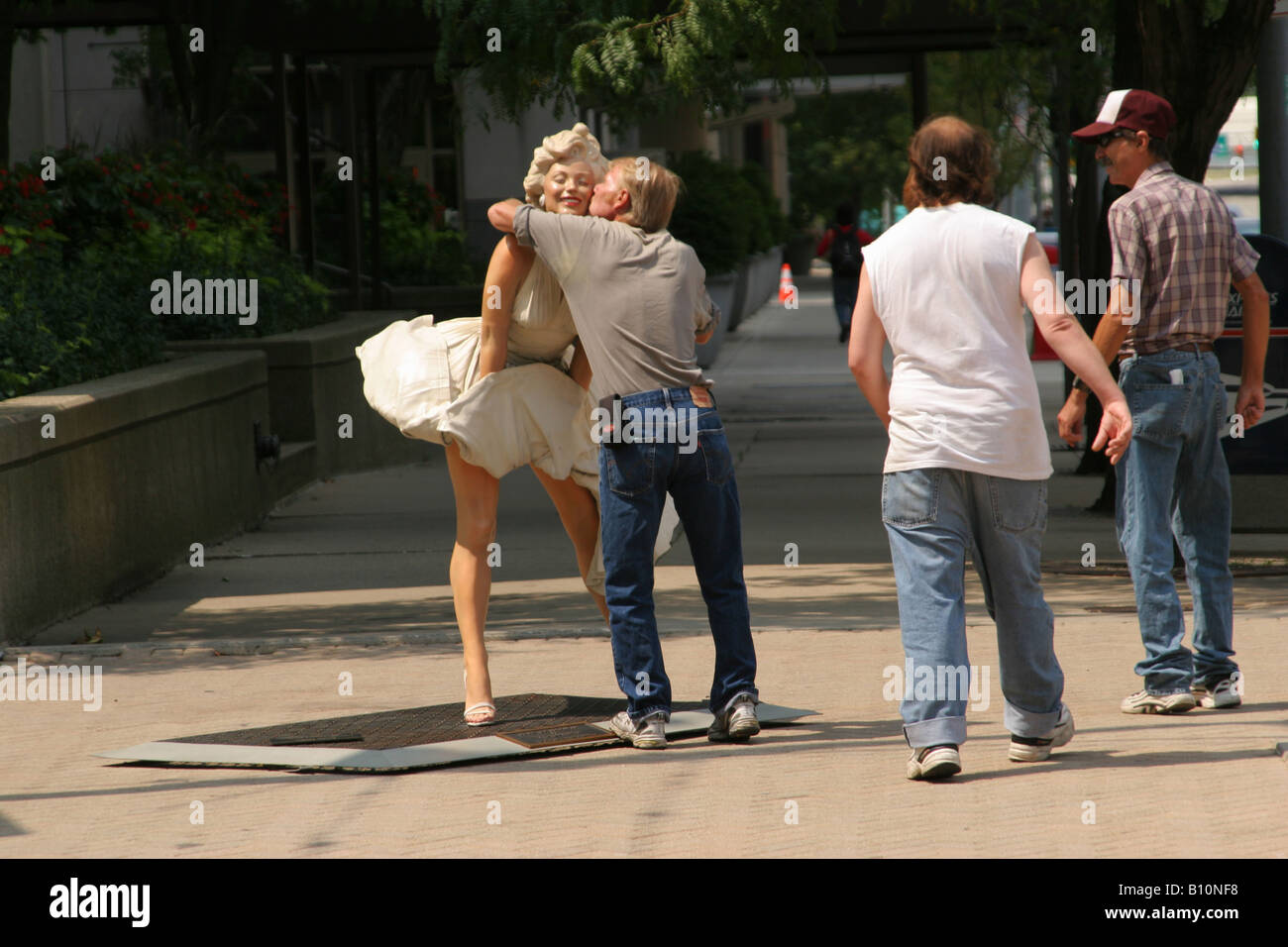 Man Kisses Sculpture named Forever Marilyn by J Seward Johnson Jr on display in Dayton Ohio Stock Photo