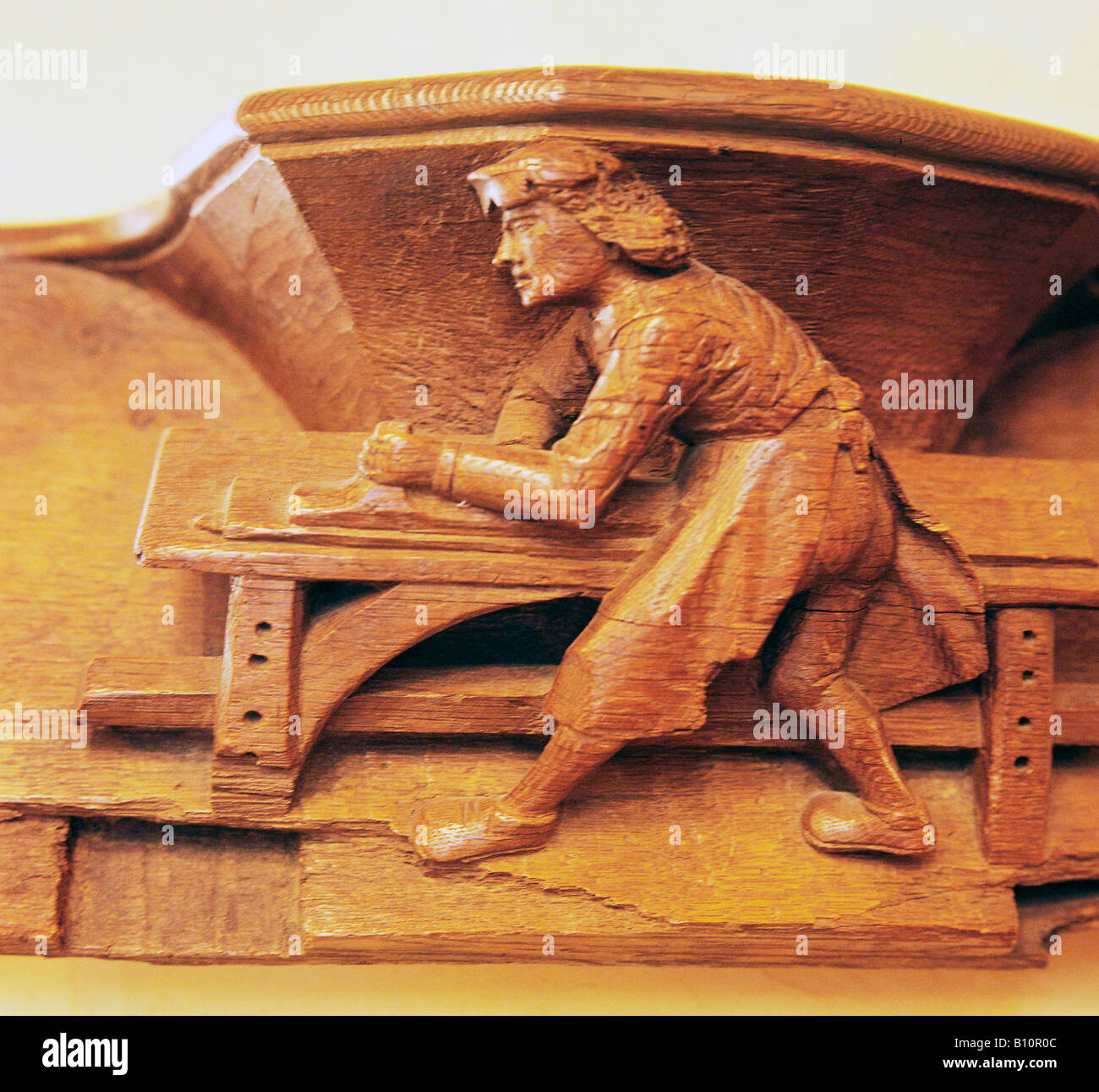 15th century misericord from Beauvais A carpenter working France Stock Photo