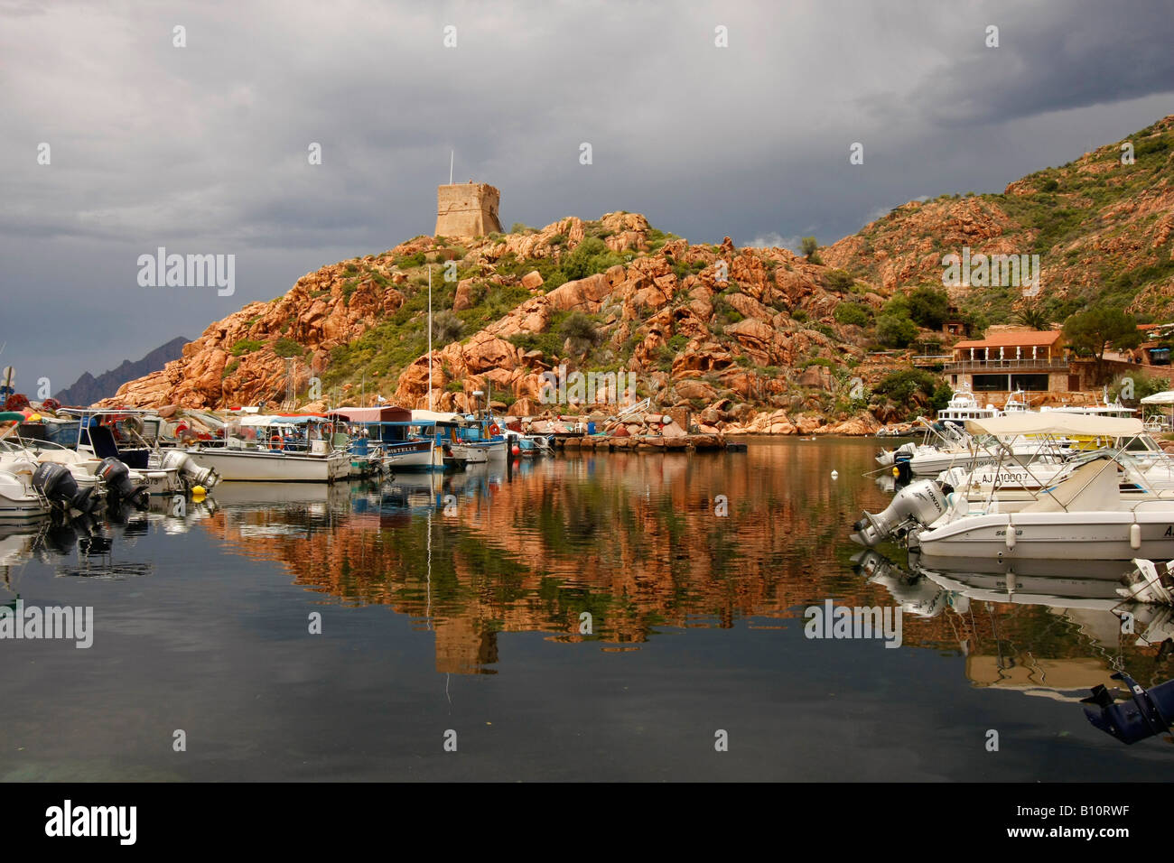 Genoese watch tower and marina in Porto Marina Corsica France Stock Photo