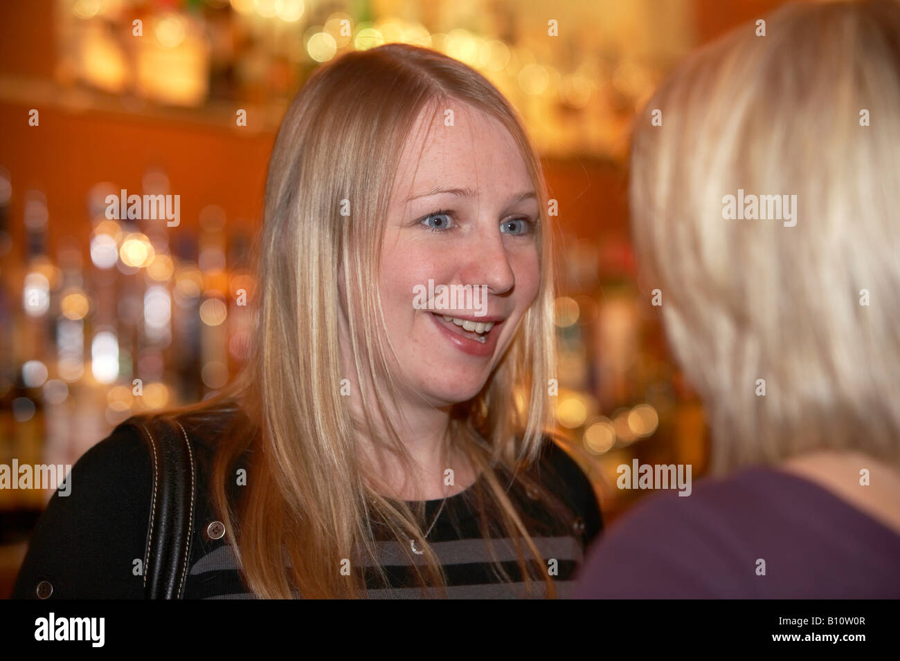 Female customers enjoying the atmosphere in a city centre bar kingston upon Hull East Yorkshire Engalnd UK Stock Photo