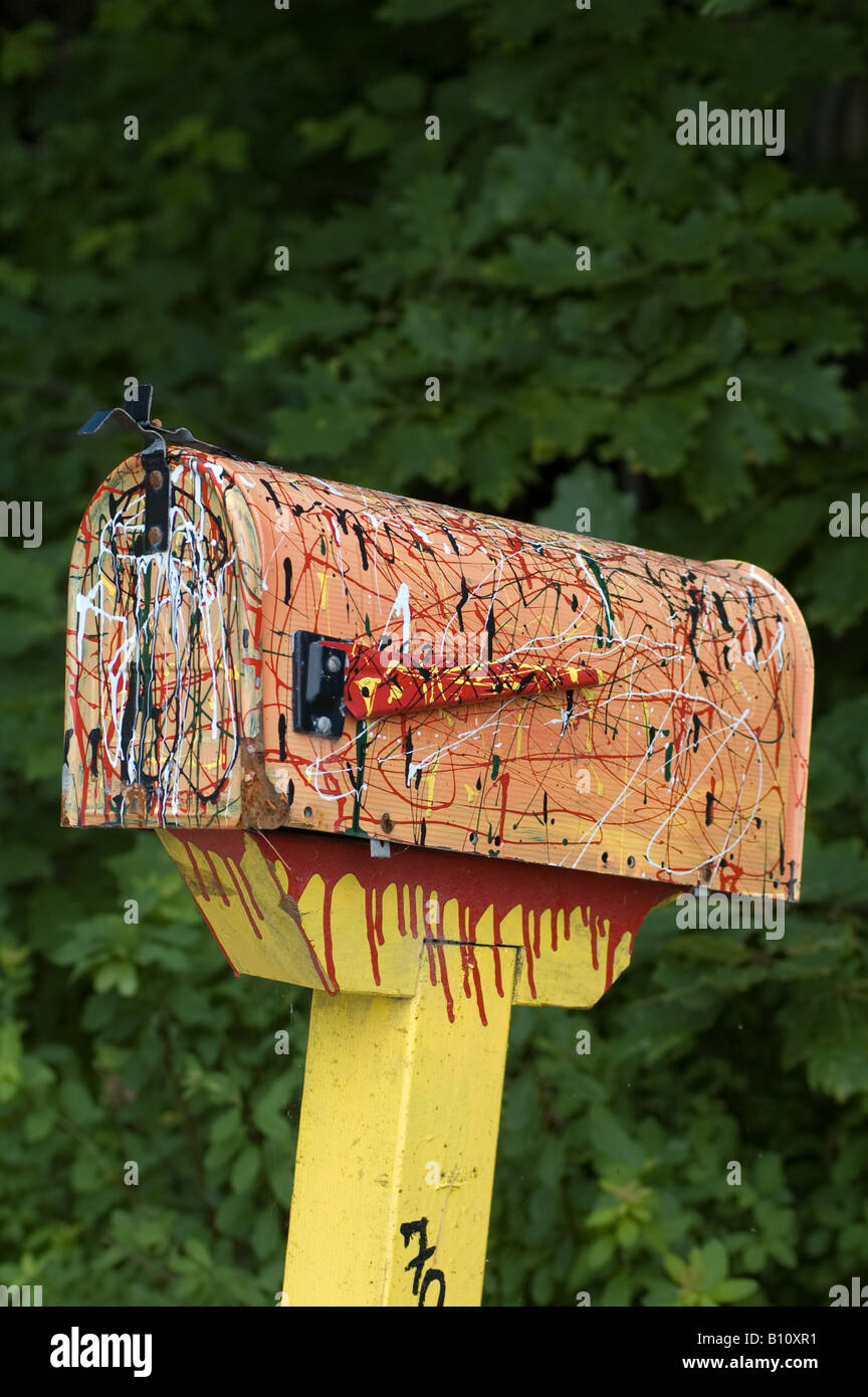 abstract painted mailbox on NH rural road Stock Photo