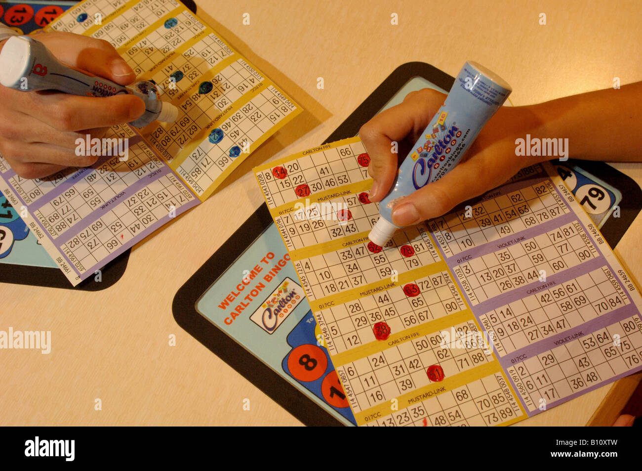 People marking bingo cards Stock Photo