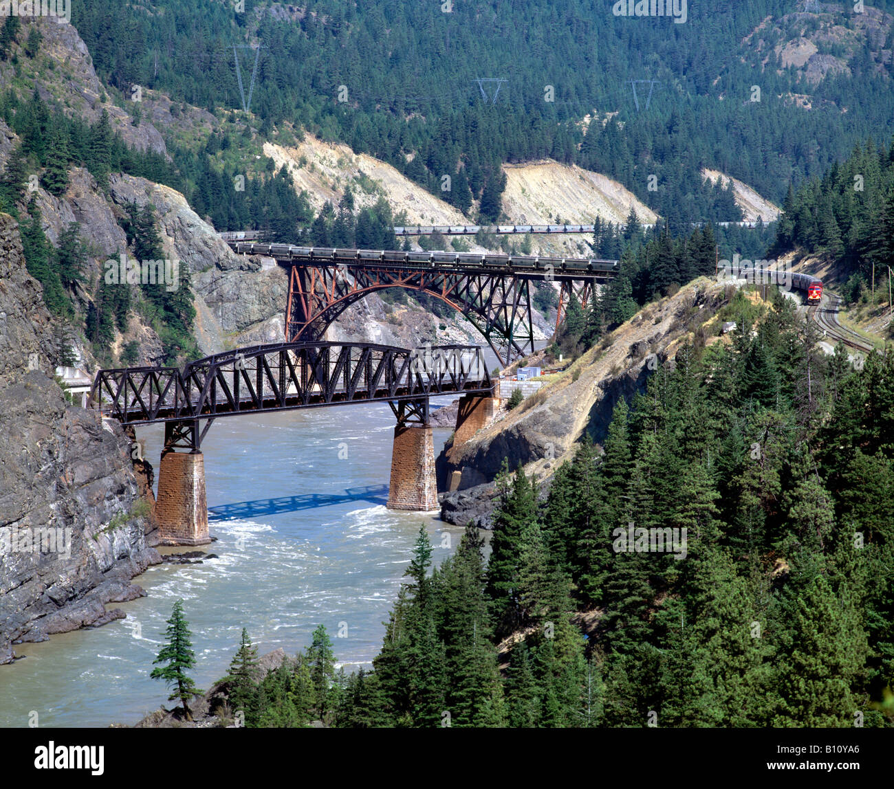 A Canadian Pacific freight train crossing the Fraser River near Lytton, British Columbia, Canada. Stock Photo