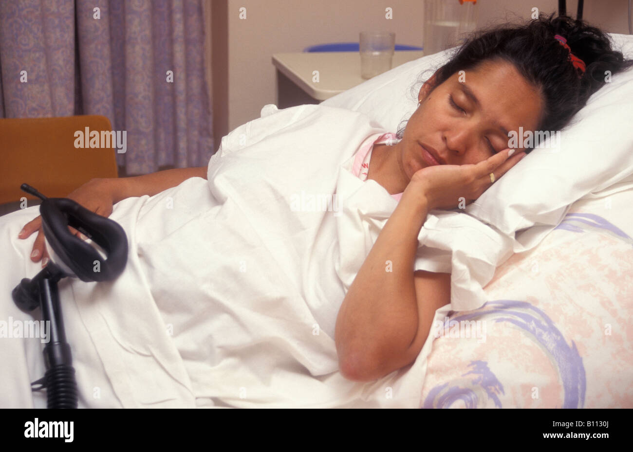 young hispanic woman in labour in hospital Stock Photo