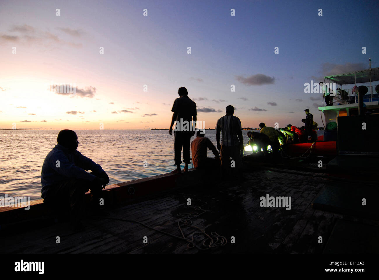 Fishermen prepare for Tuna fishing before Sunrise Indian Ocean Maldives Islands Stock Photo