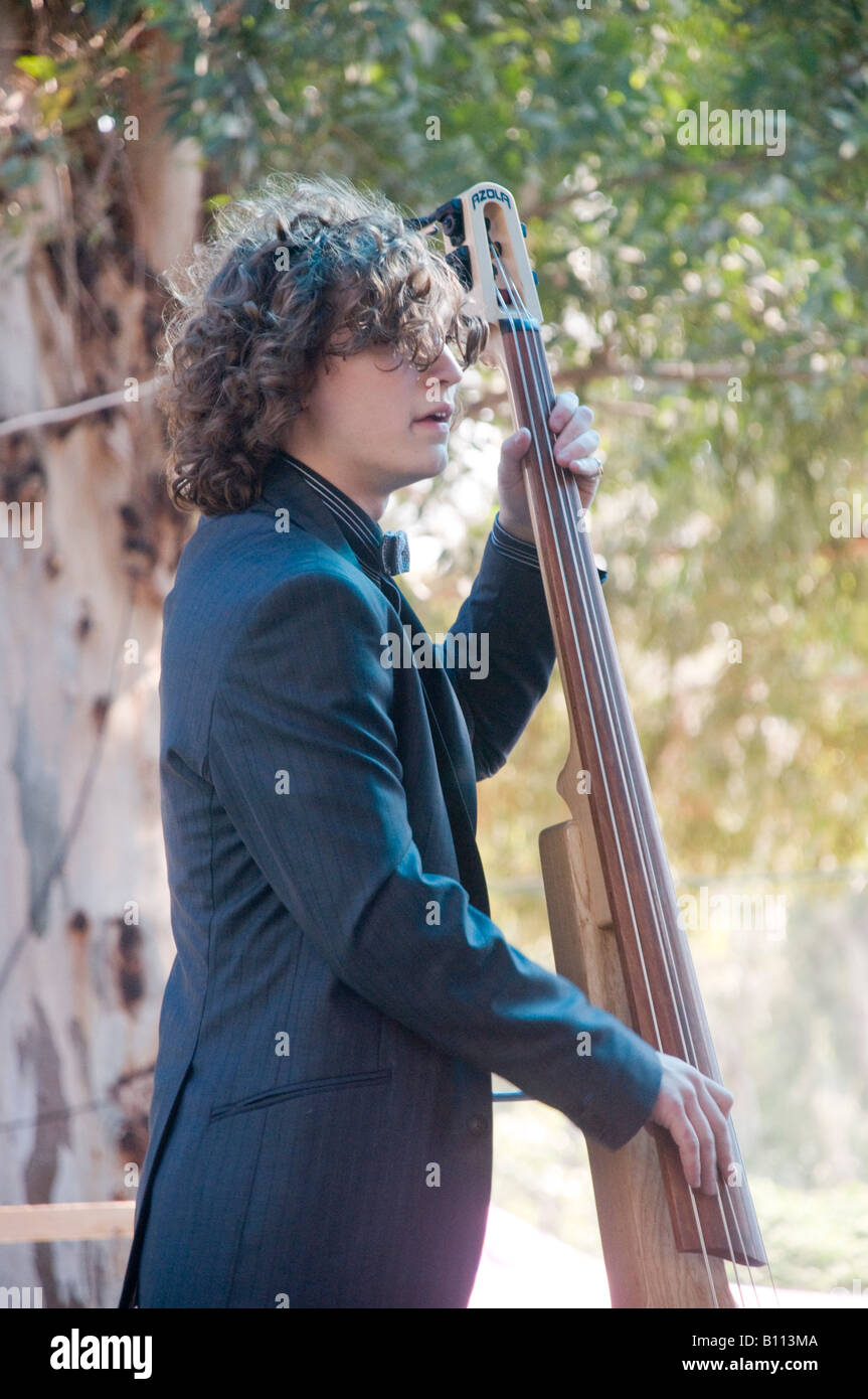 Elijah Abrams of the Abrams Brothers on stage at an outdoor concert
