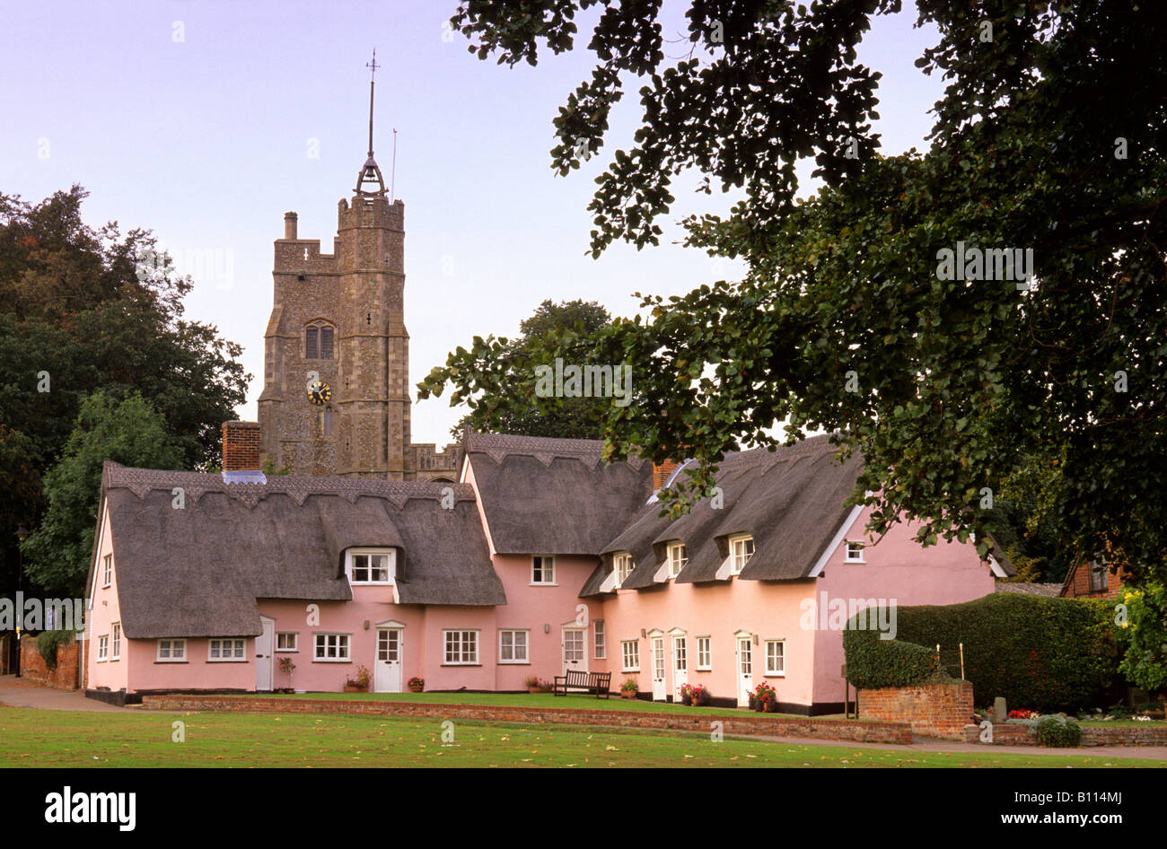 Cavendish thatched cottages and church Suffolk, England, UK Stock Photo