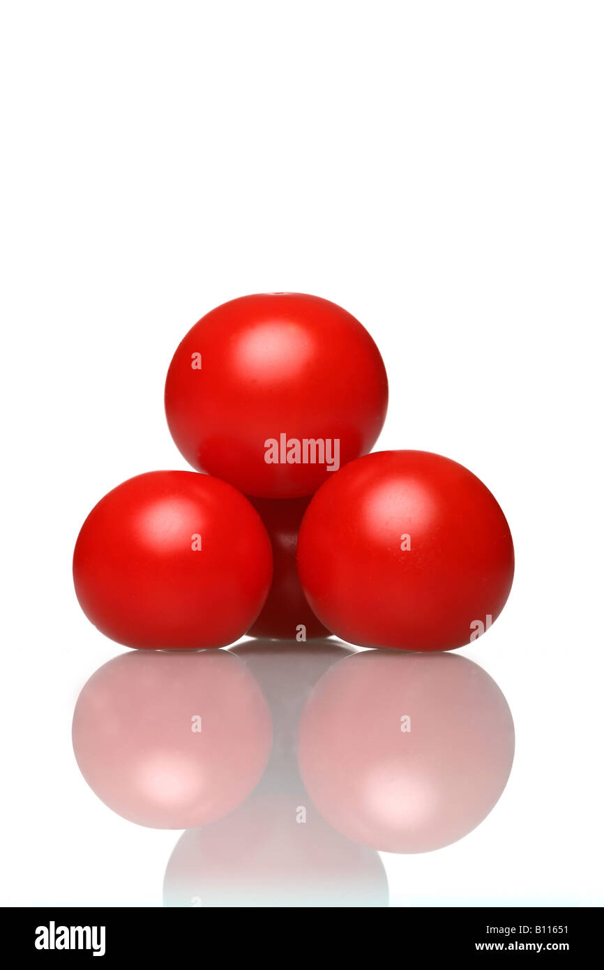 "organic tomatoes on a glass table Stock Photo - Alamy