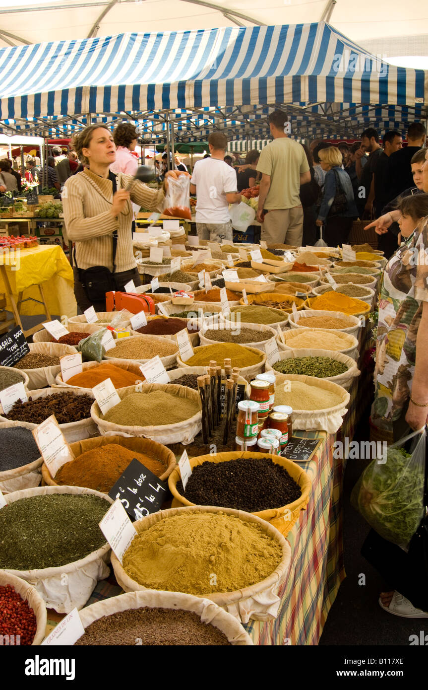 Celine Chiaradia selling spice in market in Moissac, south west France Stock Photo