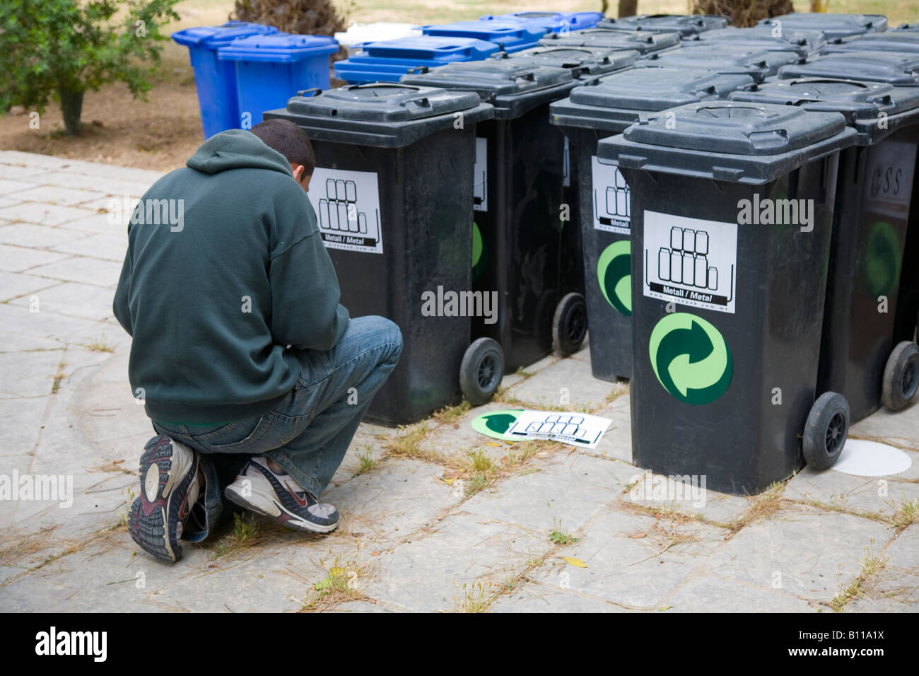 Several, many, stack of plastic metal recycling wheelie bins in Malta