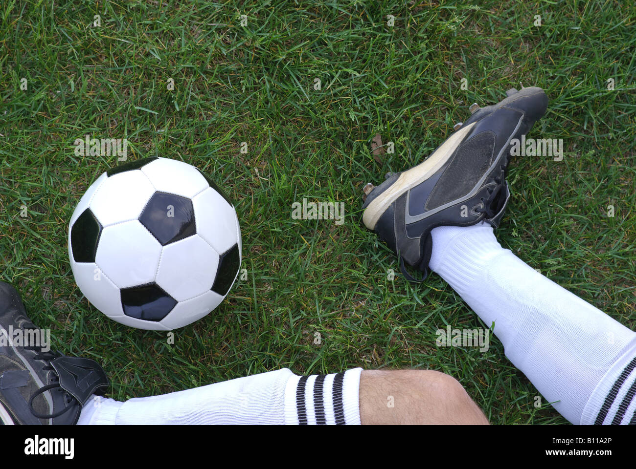 Soccer ball being kicked by player Stock Photo Alamy