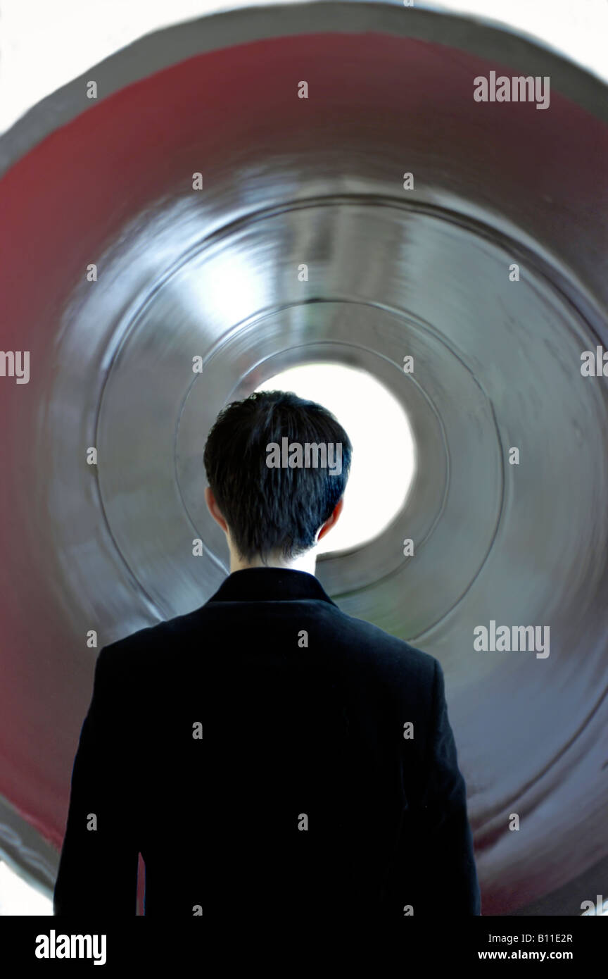 "Young Man" "From Behind" Looking down a Tunnel, "Tunnel Vision" "Back of head" ("Photo Illustration")  alone man silhouette Stock Photo