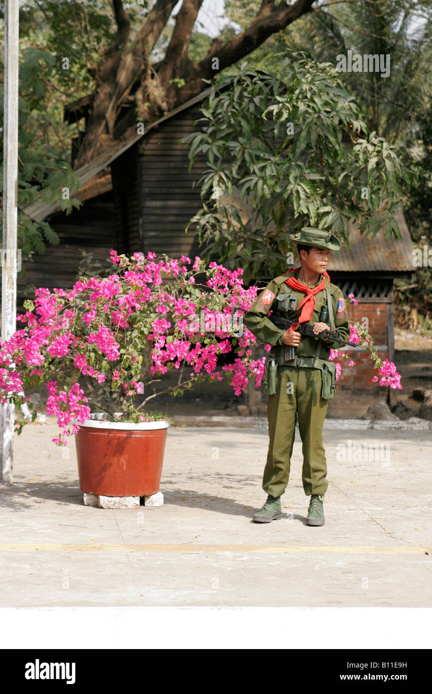 Burmese military man on the train station, Burma (Myanmar) Stock Photo