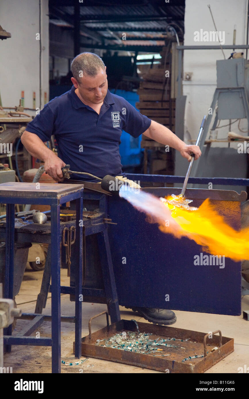 Local artisans blowing elaborate glass art pieces, Hot & kiln