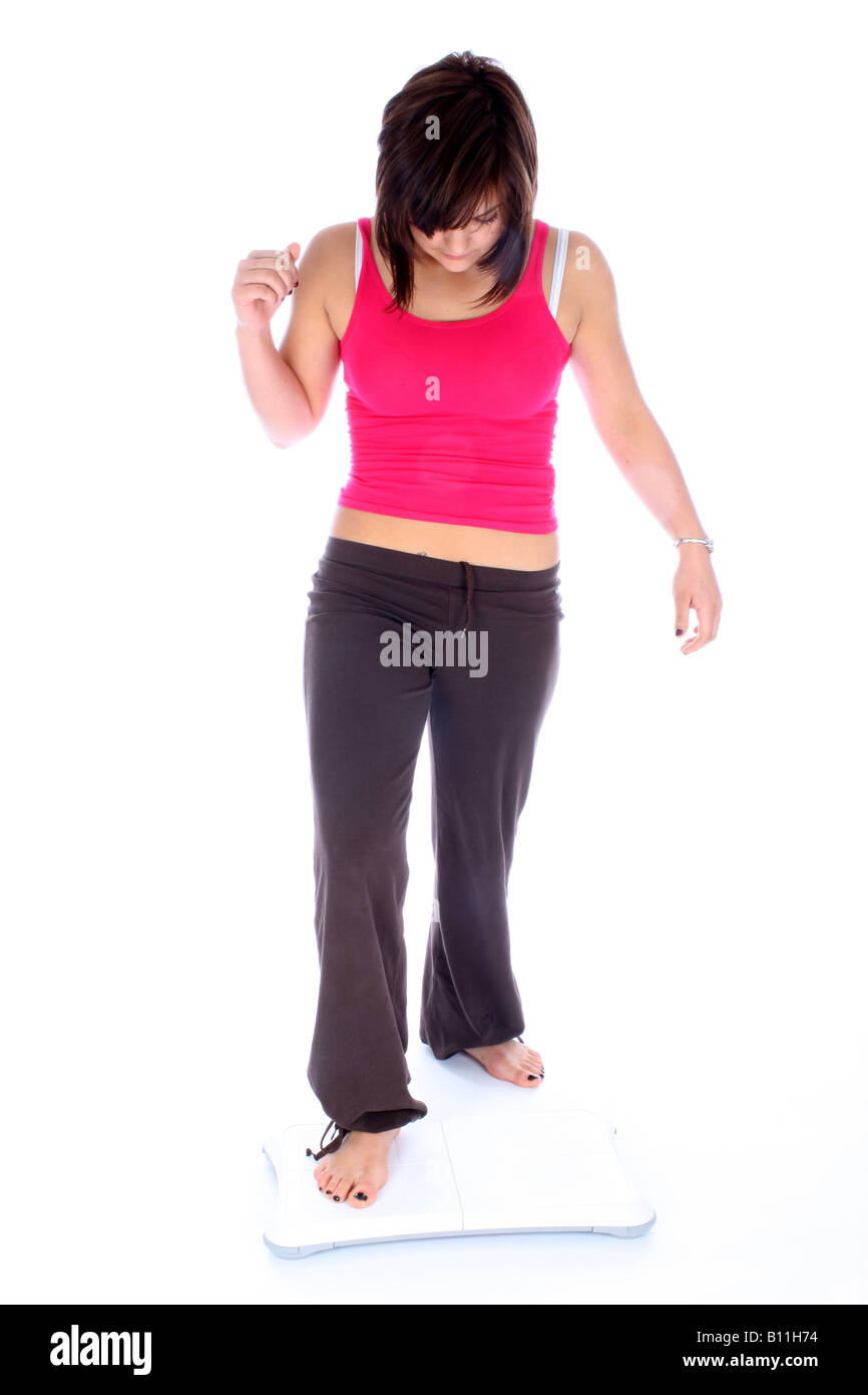 Young Woman Stepping onto Wii Fit Board Model Released Stock Photo - Alamy