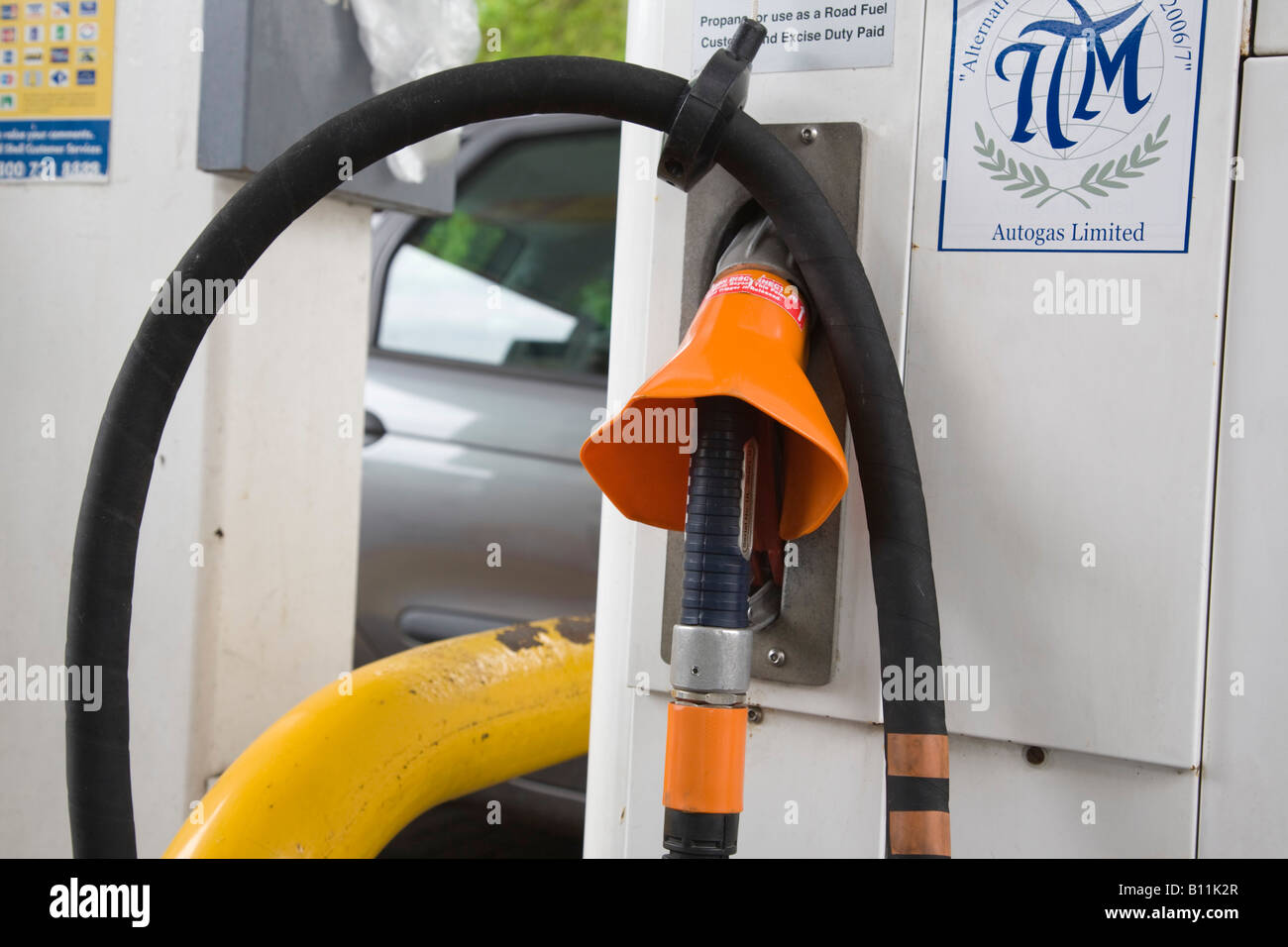 Autogas pump nozzle in petrol filling station garage Britain UK Stock Photo