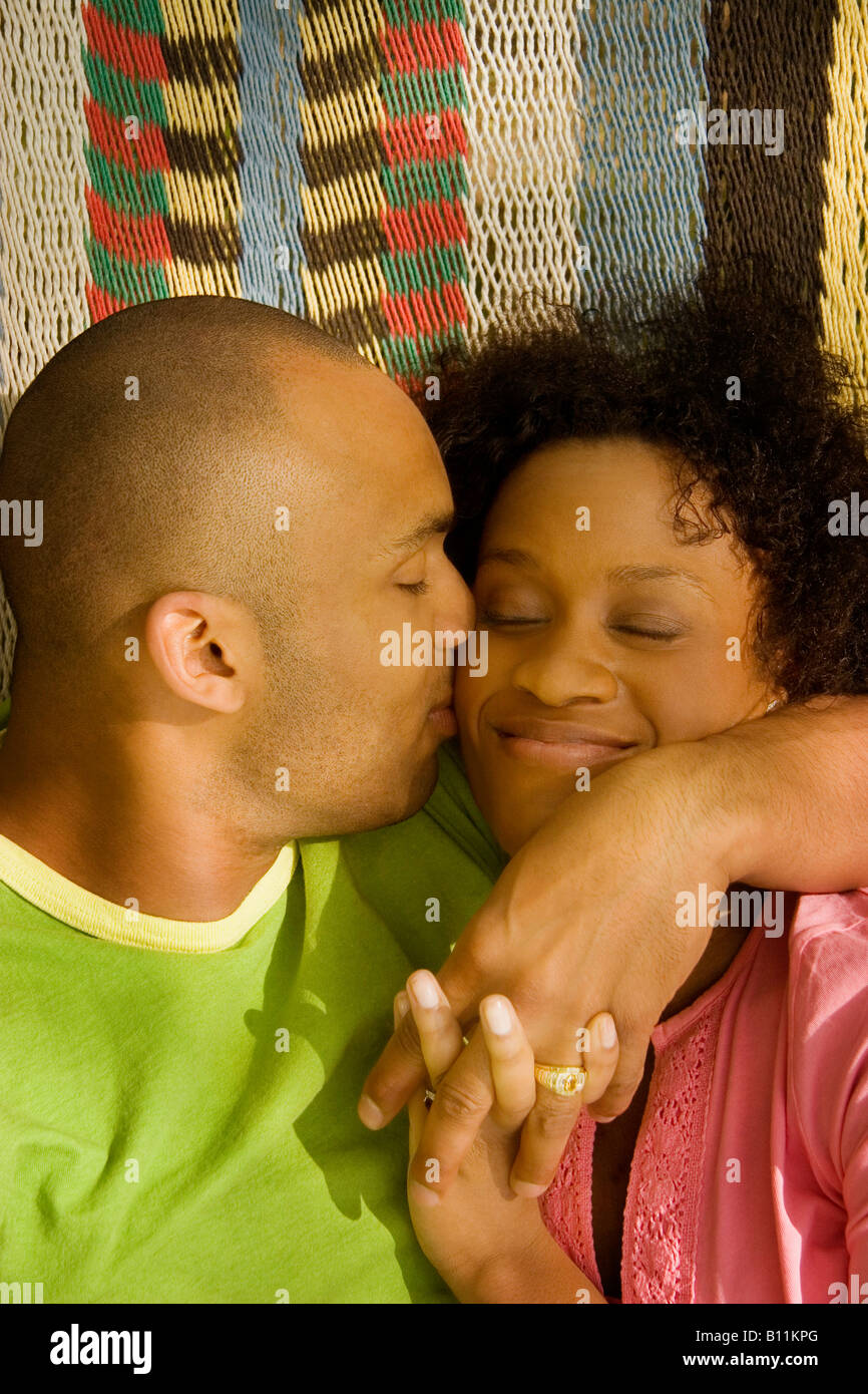 Husband kissing wife Stock Photo
