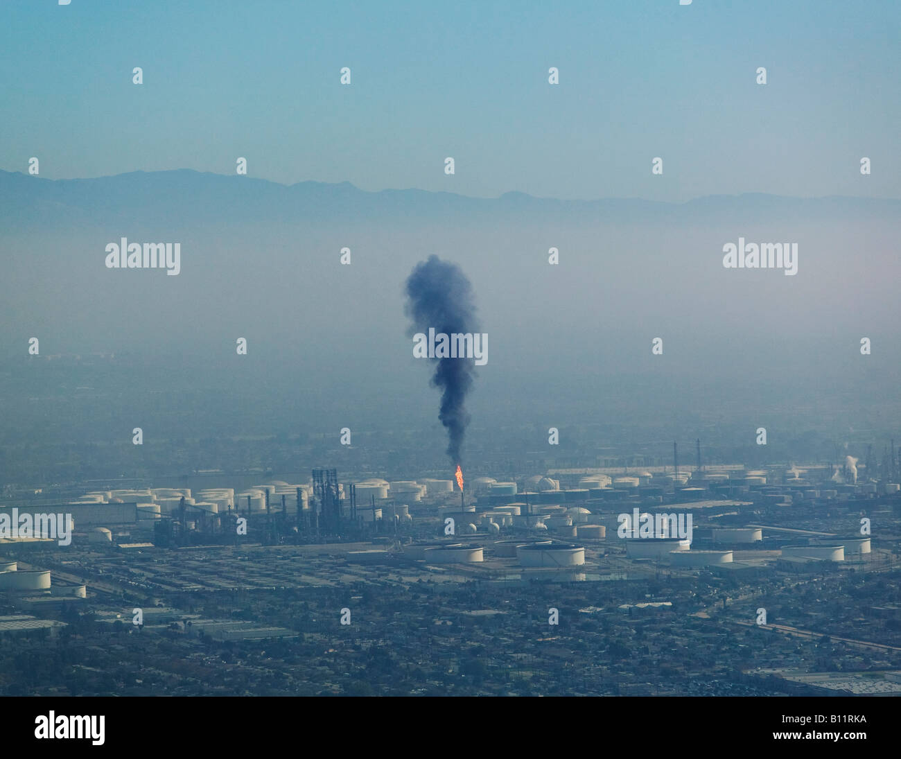 A layer of air pollution hangs over Los Angeles as a Long Beach refinery releases particulates Stock Photo