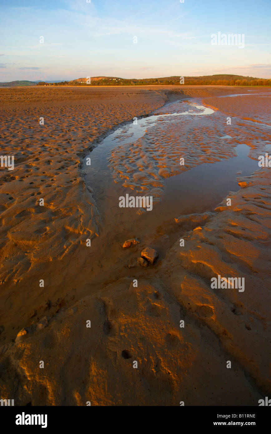 View across the dangerous quicksand mud flats of the Arnside estuary of the river Kent in Lancashire England Stock Photo