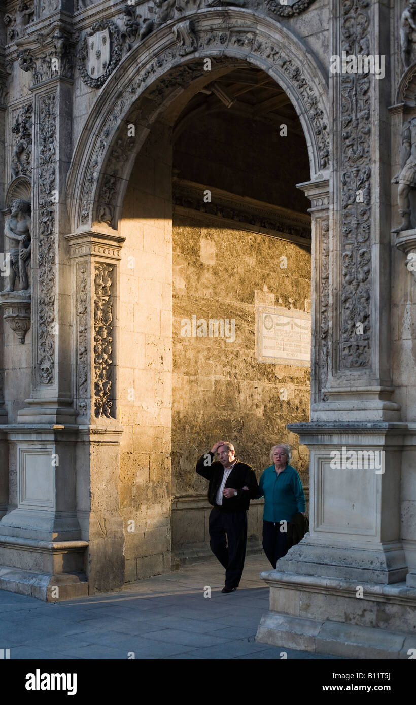 Senior couple passing under the City Hall arch or Arquillo, Seville, Spain Stock Photo