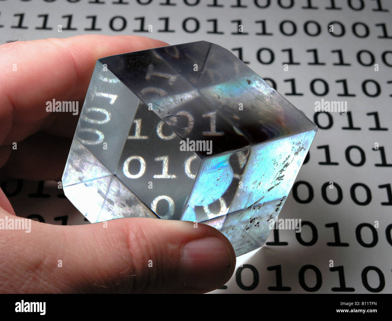 Digital gackground showing binary numbers changed in a plastic cube Stock Photo
