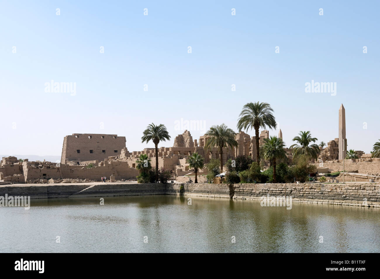 Precinct of Amun from across the Sacred Lake, Temple of Karnak, Luxor, Nile Valley, Egypt Stock Photo