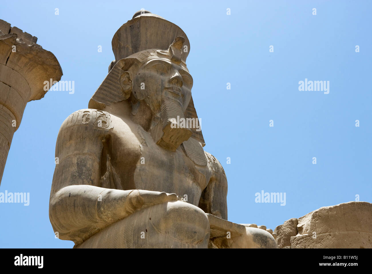 Seated Colossus of Ramses II in the Colonnade of Amenophis III, Luxor Temple, Luxor, Nile Valley, Egypt Stock Photo
