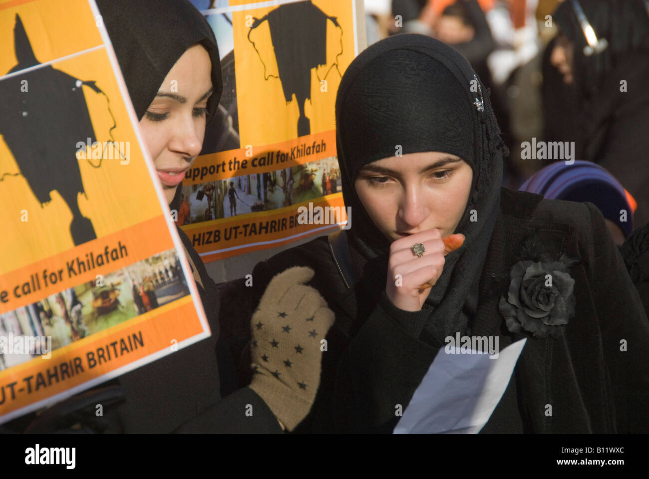Women in Islamic dress with posters supporting Khilafah and Abu Ghraib image at Hizb ut-Tahrir Britain rally in London Stock Photo