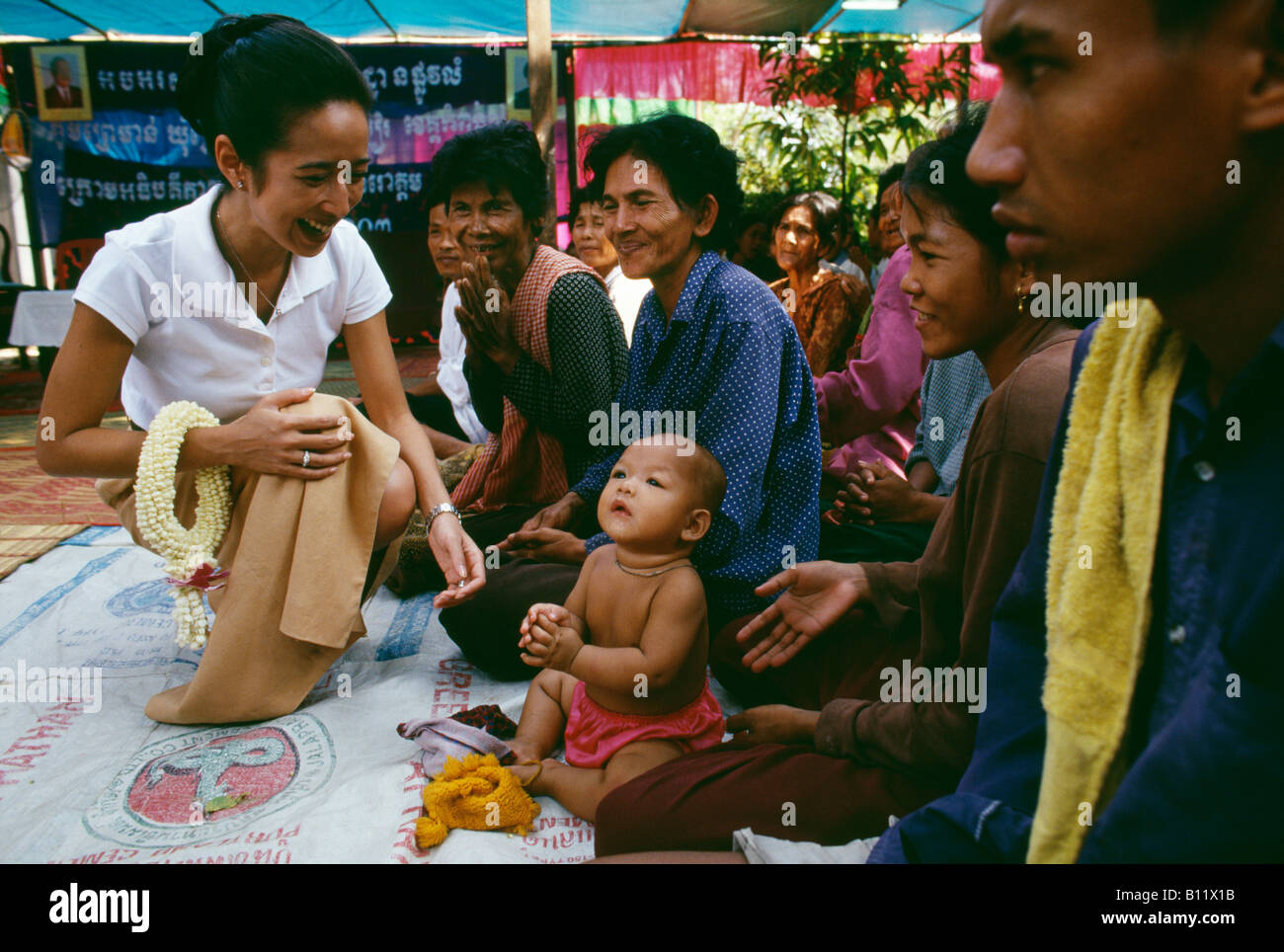 Princess Rattana Norodom of Cambodia handing out alms and interacting with the poor people in the villages of Cambodia Stock Photo