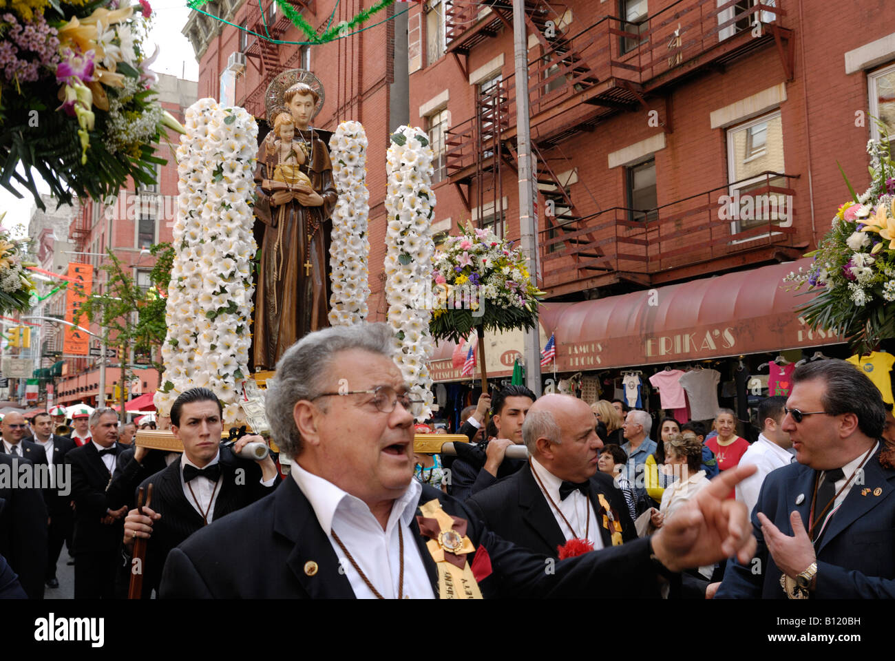 Members of the Society of Saint Anthony of Giovinazzo march up Mulberry Street in Little Italy in NYC. Stock Photo