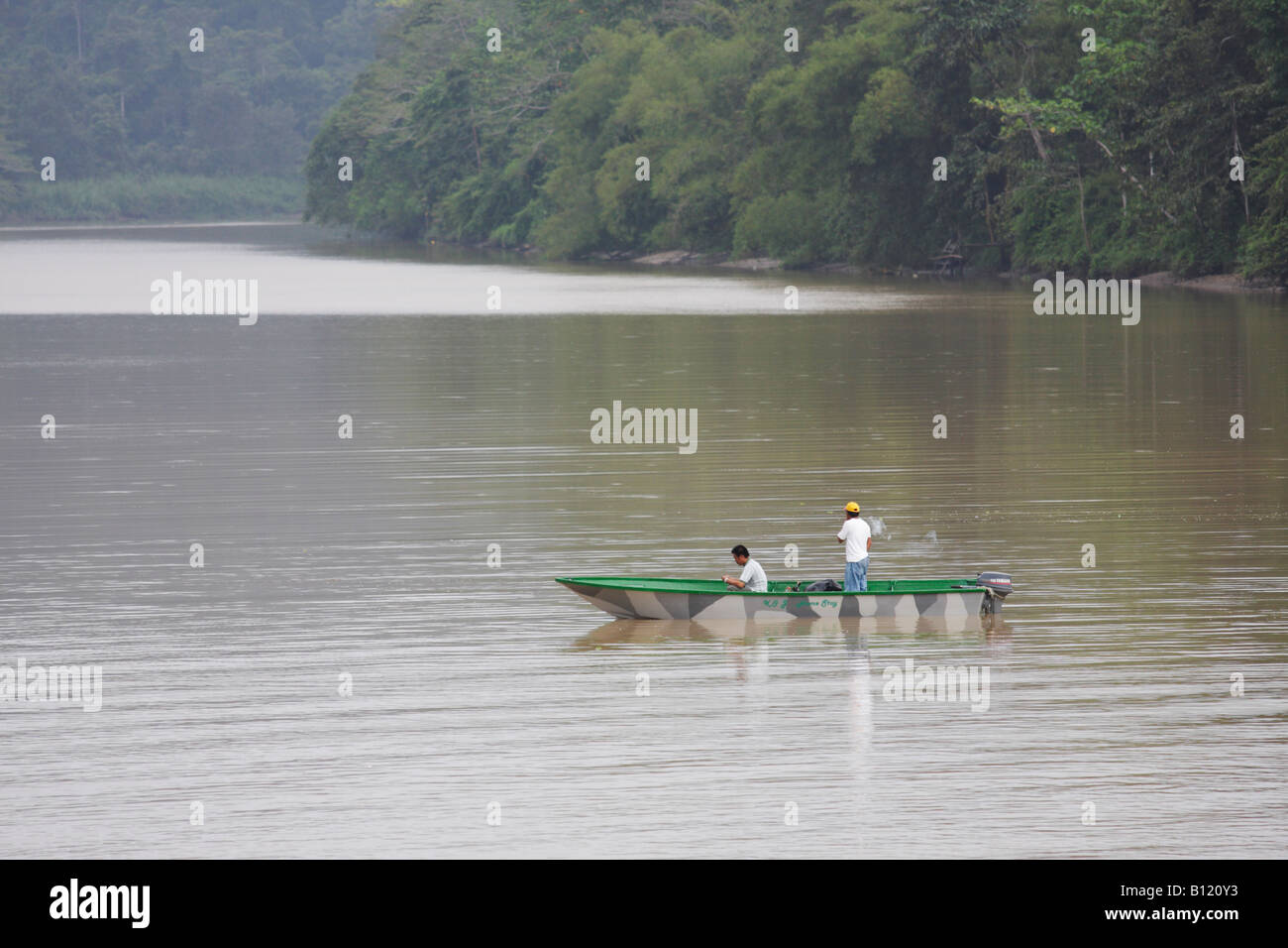 Men Fishing In Jungle River, Sukau, Sabah, Malaysian Borneo Stock Photo