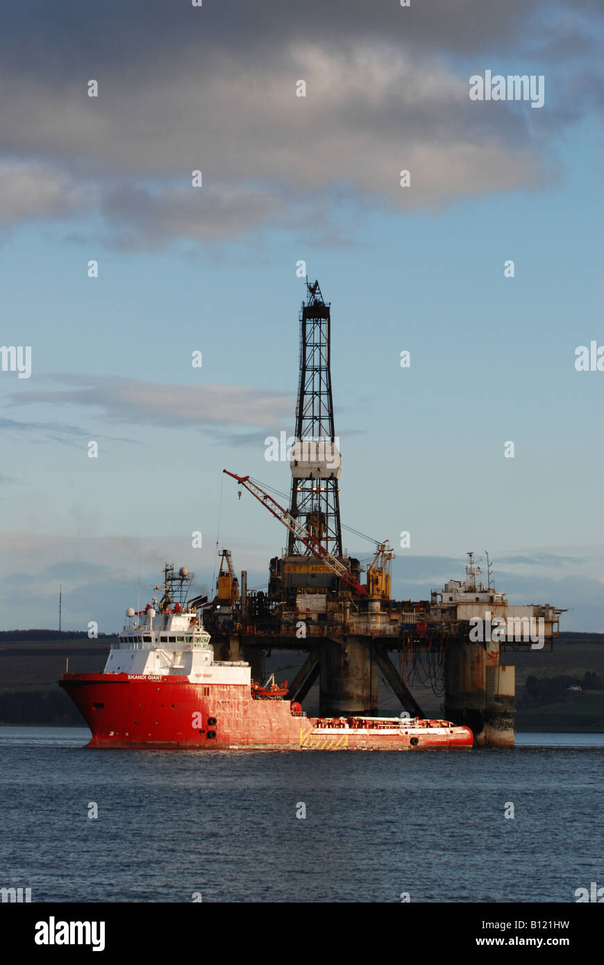 Oil Rig (GSF Arctic III) and Support Vessel (Skandi Giant) in the Cromarty Firth, Invergordon, Scotland Stock Photo