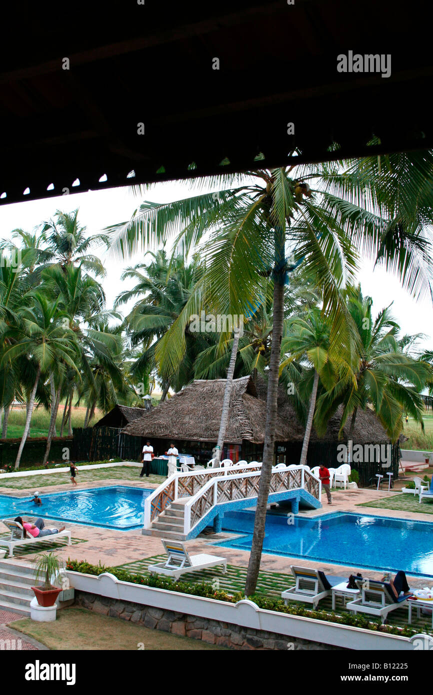 Swimming pool viewed from balcony of a luxurious suite room of a resort hotel in kerala Stock Photo