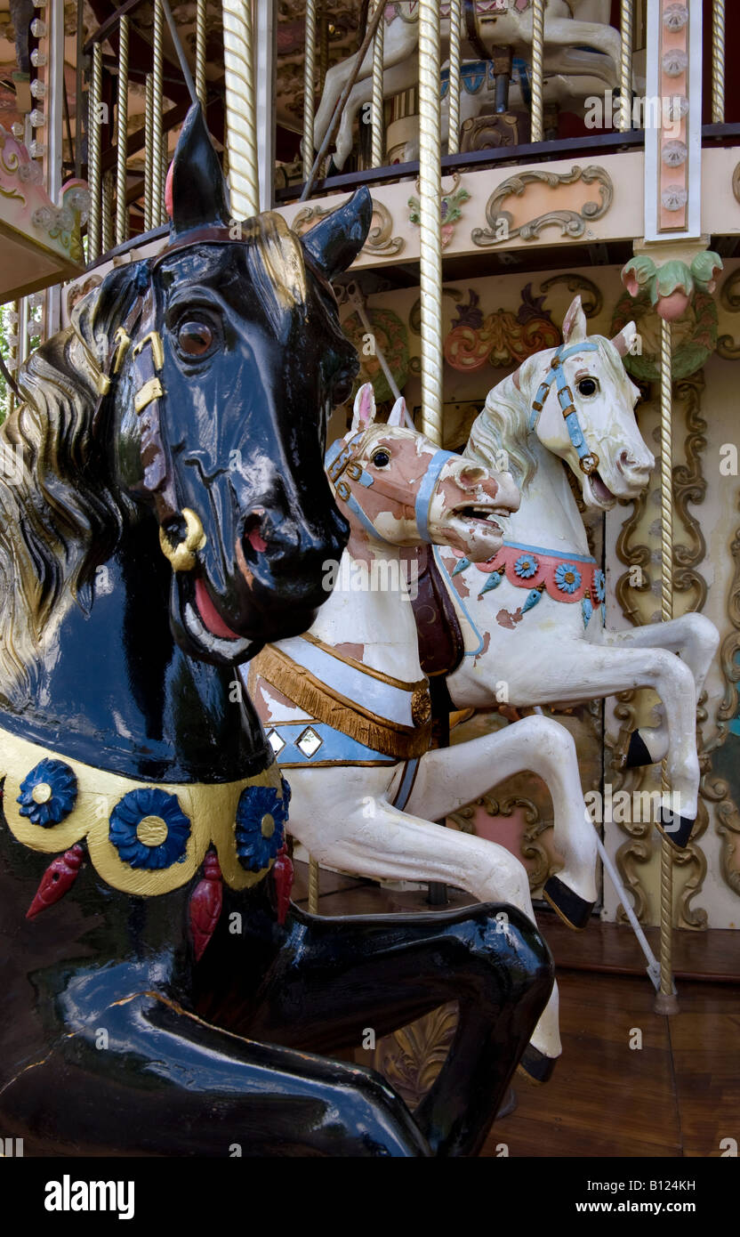 Rides on carousel in city park Stock Photo
