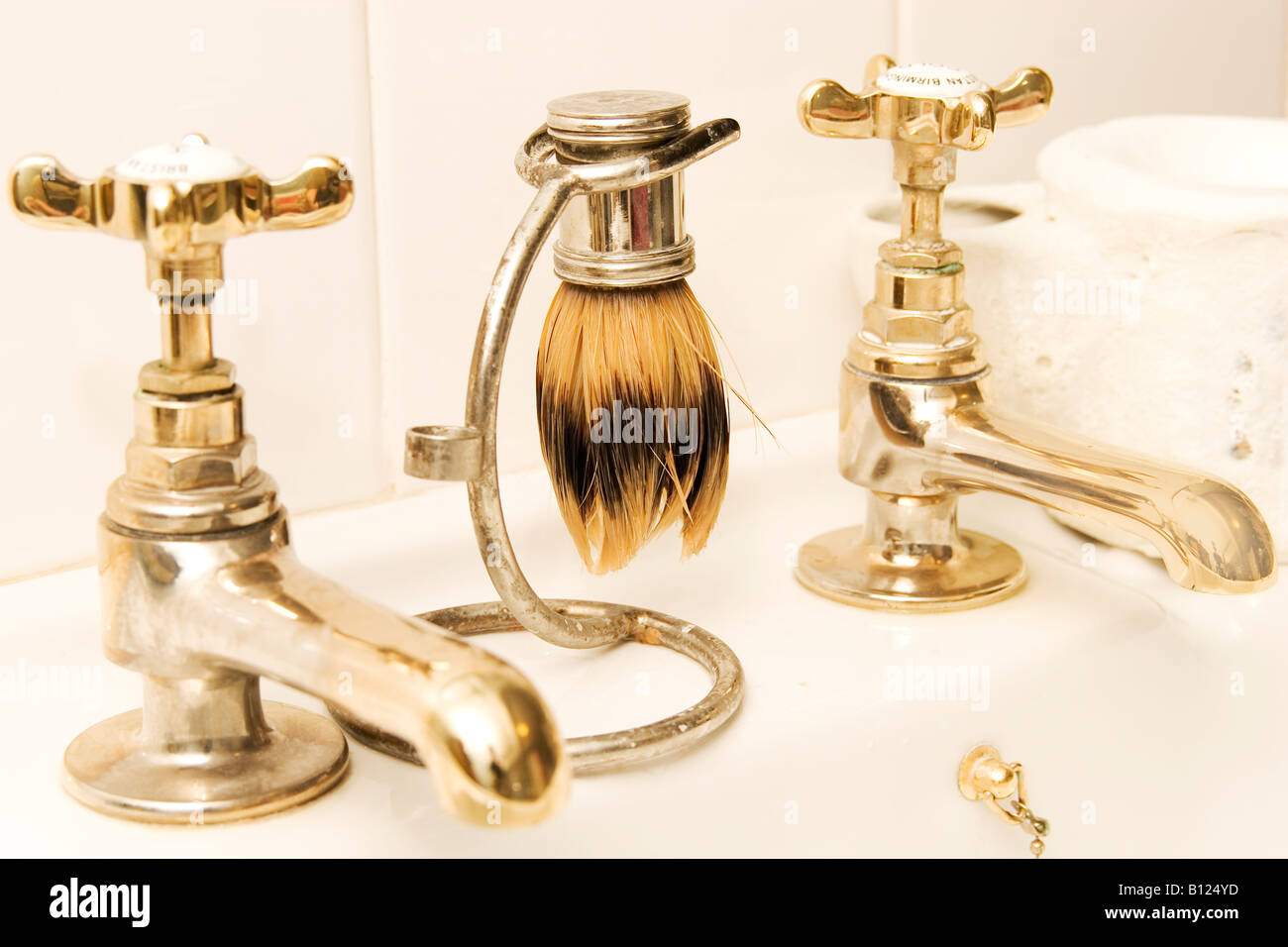 bathroom scene with old fashioned shaving brush and soap mug Stock