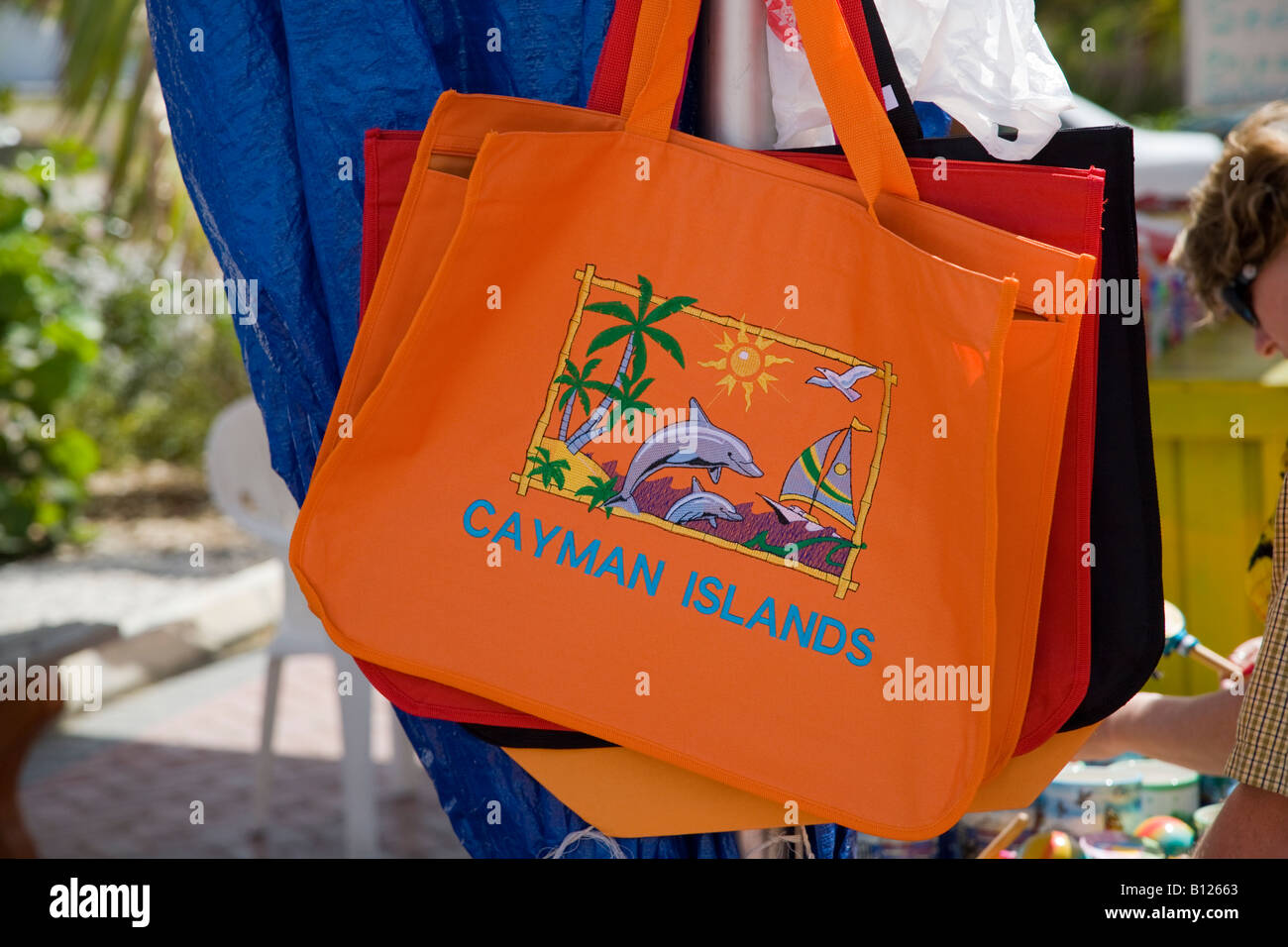 Colorful tote bags in downtown shopping tourist area of Georgetown Grand Cayman Cayman Islands in the Caribbean Stock Photo