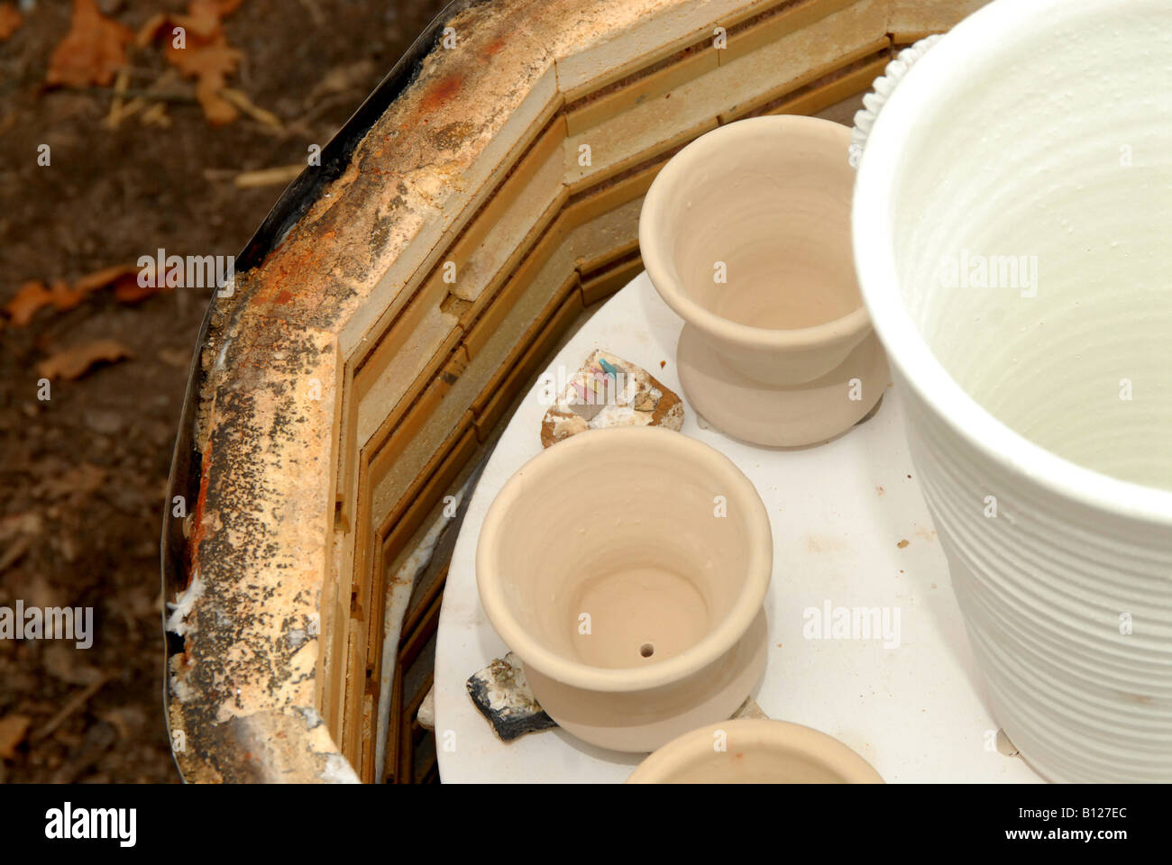 A ceramic firing kiln being loaded in preparation for firing Stock