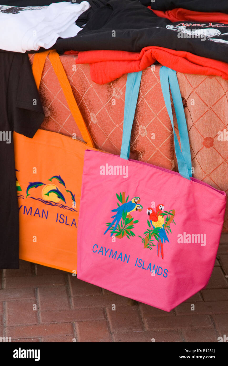Colorful tote bags in downtown shopping tourist area of Georgetown Grand Cayman Cayman Islands in the Caribbean Stock Photo