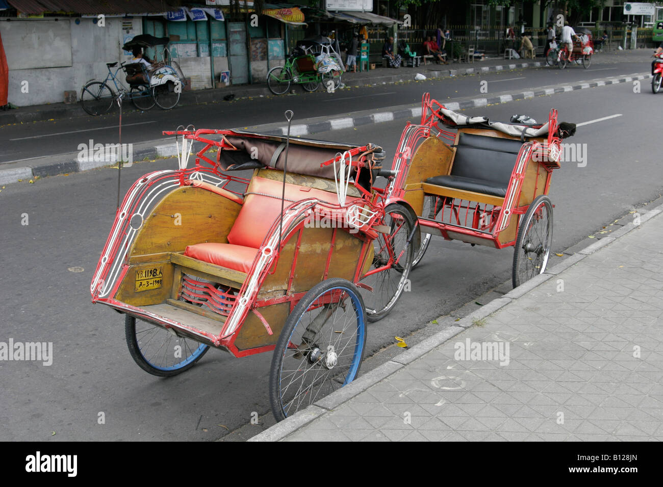 Becaks on the street of Yogyakarta (Jogja), Java, Indonesia Stock Photo ...