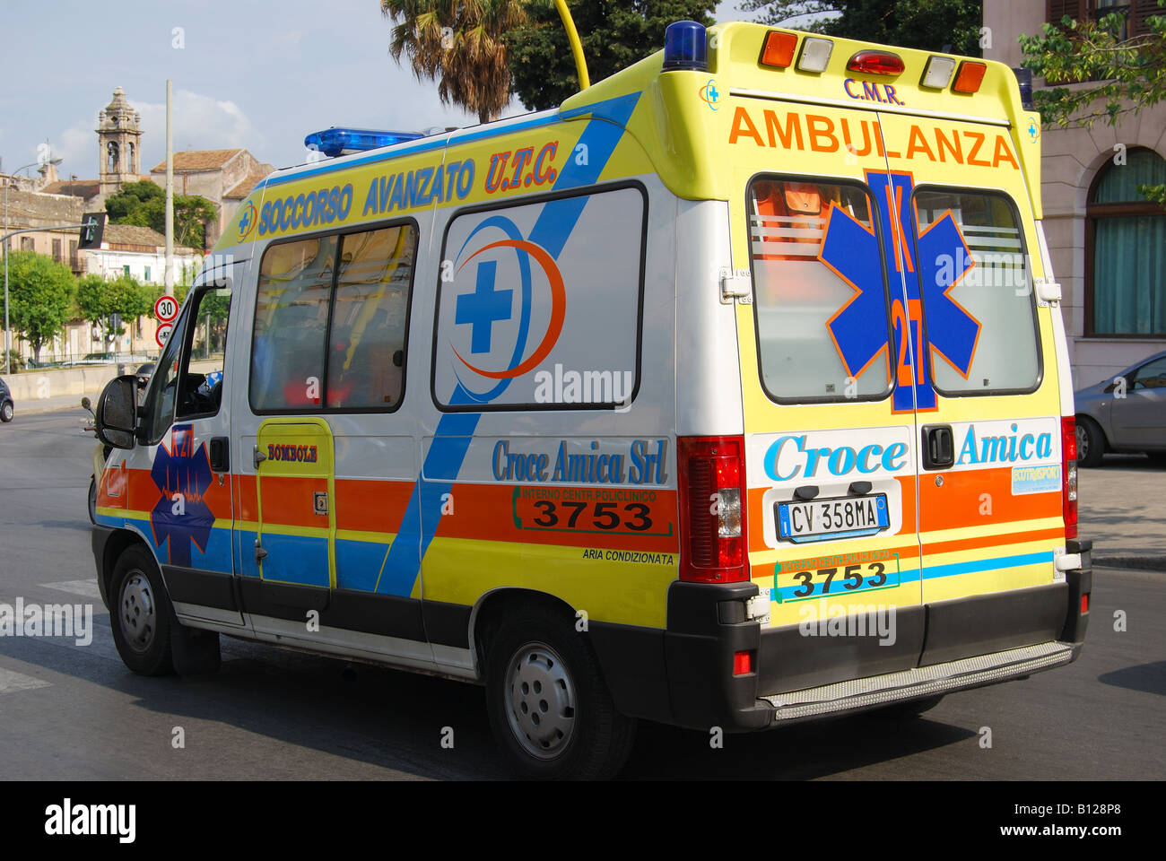 Ambulance passing in street, Cassaro Quarter, Palermo, Palermo Province, Sicily, Italy Stock Photo