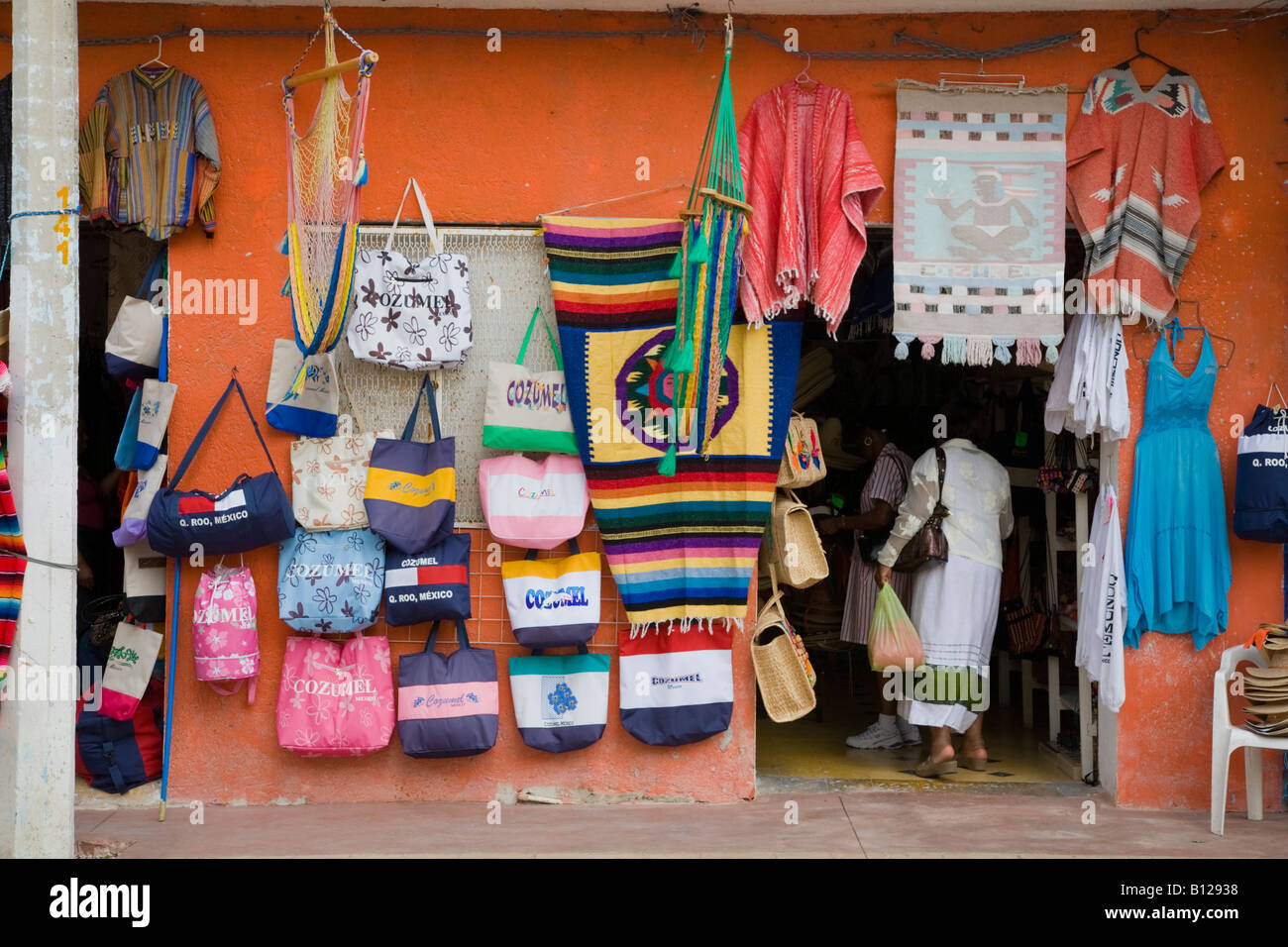 Colorful bags hanging on wall in downtown tourist shopping area of San Miguel on the island of Cozumel Mexico Stock Photo